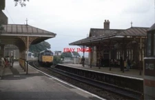 PHOTO  CLASS 31 31423 PASSES A CLASSMATE AT GRANGE-OVER-SANDS IN JULY 1990