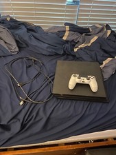 Sony PlayStation 4 Pro console w/ hdmi and powers cords with a white controller