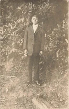 Postcard RPPC Young Man in Suit Outdoors AZO Stamp Box