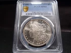 1887-S MS64 Morgan Silver Dollar PCGS Certified - White/Gold Shield Holder