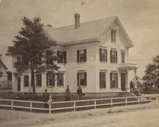FAMILY OUTSIDE GRAND WOOD FRAME HOUSE. CHILD ON FENCE POST. STEREOVIEW, MASS.