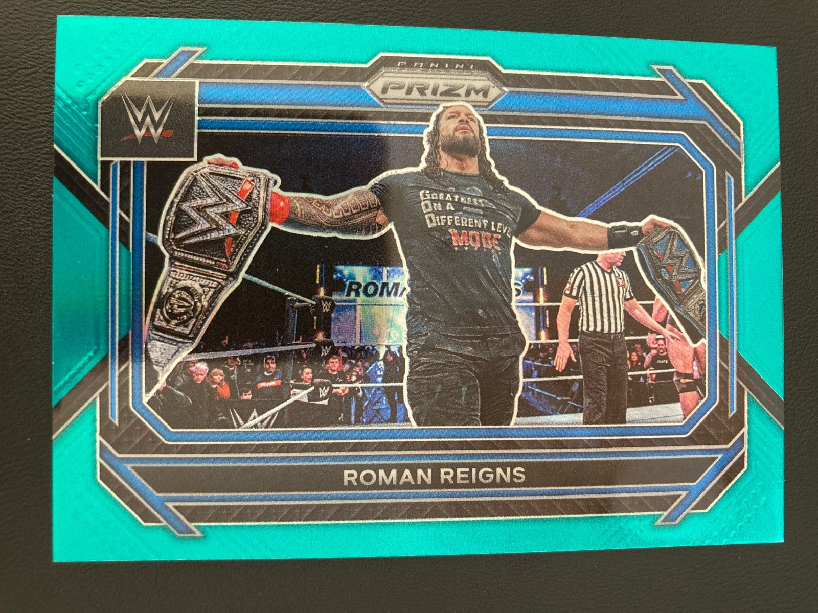 2023 Panini Prizm WWE Teal Prizm 29 Roman Reigns ed/49