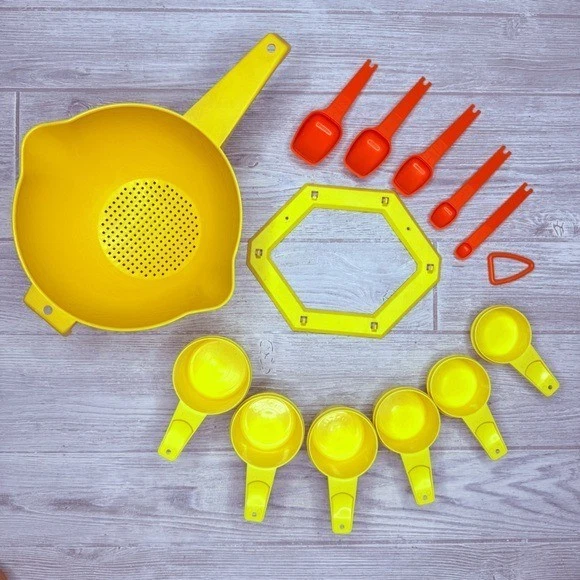Vintage Tupperware bundle measuring cups , measuring spoons , hooks and strainer