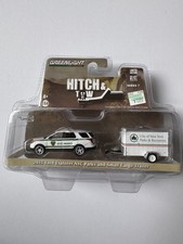 Remolque de carga Greenlight Hithch & Tow, Ford Explorer NYC 2015 parques y pequeño 1:64