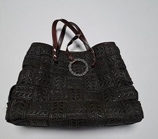 Cartera Alma Tonutti patrón tejido cierre a presión interior bolsillo con cremallera