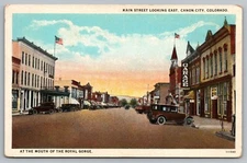 Main Street Orchard District Looking East Canon City CO Postcard Old Cars
