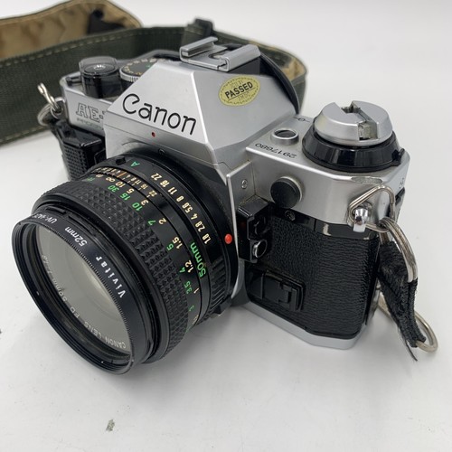 Fotocamera reflex 35 mm Canon AE-1 Program vintage con 2 obiettivi 2 flash manuale extra - Foto 4 di 22