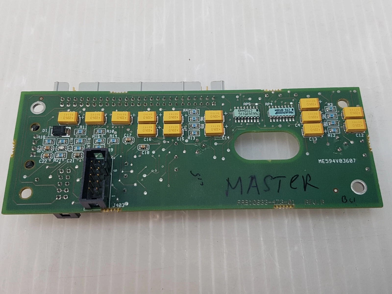 Back of the Lumenis 0633-474-01 Rev. B pyro board with tantalum capacitors and header