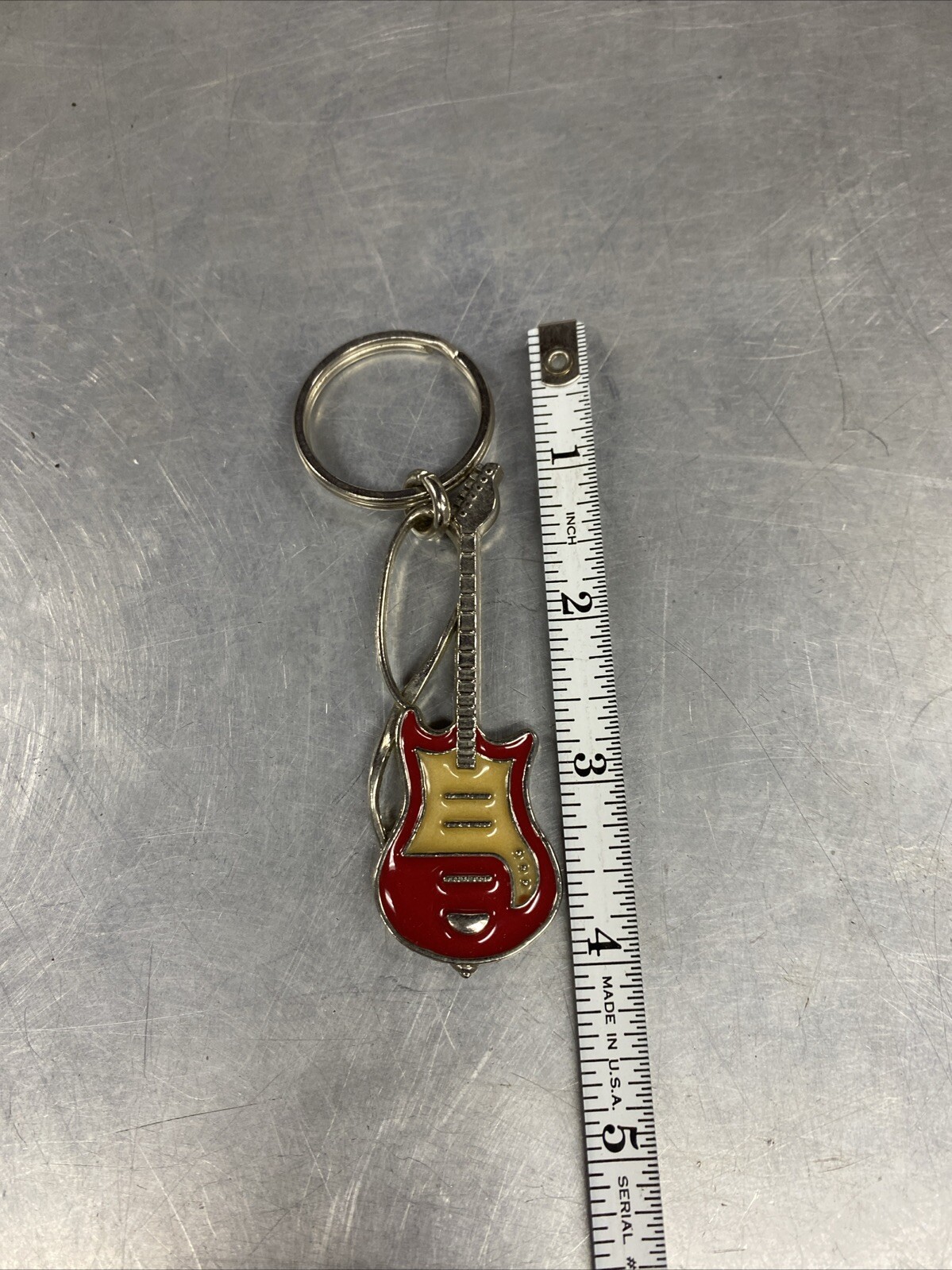 VINTAGE CROWN MARKED ELECTRIC GUITAR SHAPED METAL ENAMELED KEYCHAIN