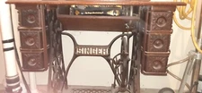 antique singer sewing machine in cabinet WITH original manuals and attachments
