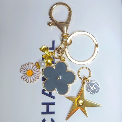 CHANEL holiday charm comet star key holder flower