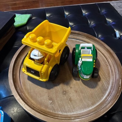 2 vehicles: Mega Bloks CAT Dump Truck and John Deere Tractor 