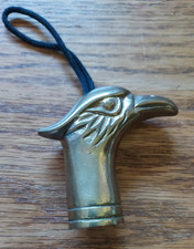 VINTAGE CANE BRASS EAGLE HEAD WITH ATTACHED STRAP