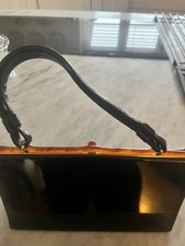 vintage leather handbag, black patent leather ,Amber top detail ,clip closure.