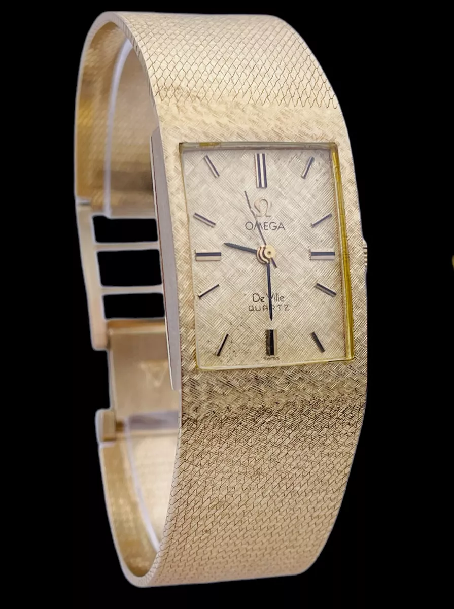 Omega 14k gold watch top