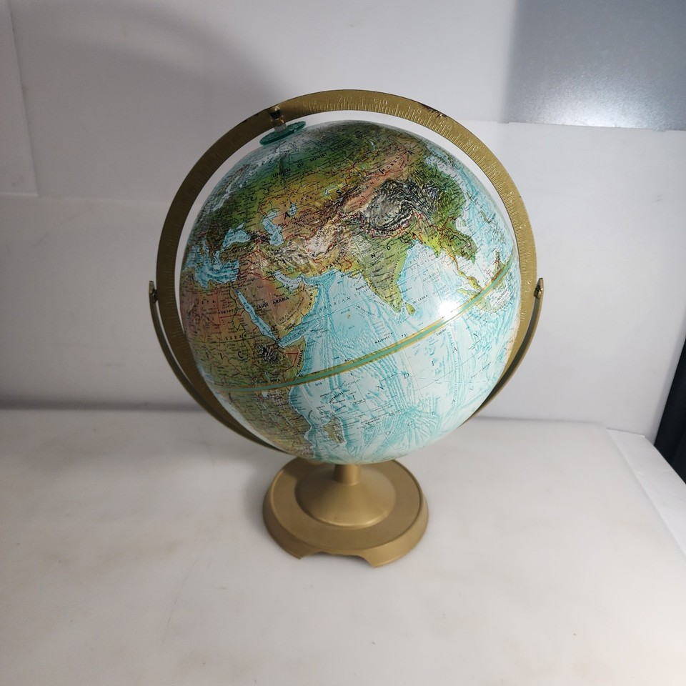 A 12" Replogle World Oceans Series globe with raised relief and USSR-era borders — tactile, gorgeous, and a living snapshot of Cold War geopolitics.