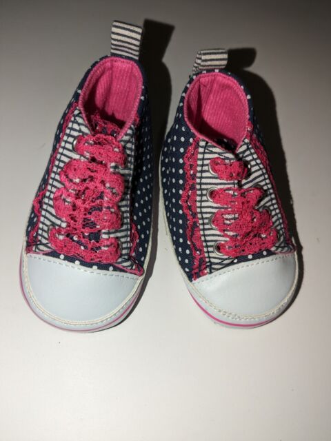 Baby girl shoe with skulls on the side size 0 to 6 months (Spencer&#039;s Gifts)