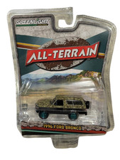 Greenlight GREEN MACHINE CHASE 1996 Ford Bronco Matte Black & Camoflouge 1/64