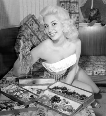 Actress Bernice Swanson with the jewellery she has collected- 1957