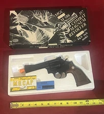 VINTAGE MGC #M-586 .357 COMBAT MAGNUM REVOLVER + 6 CARTRIDGES+100 7mm w/O.B. NOS