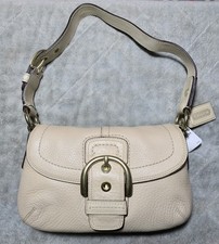 Coach Beige Pebbled Shoulder Bag With Buckle Accent  Bag Charm