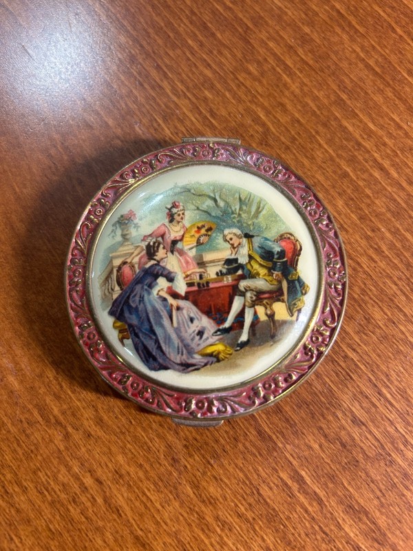 1930's- 1940's  I believe.  Vintage enamel compact with courting scene