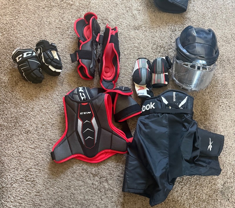 Youth hockey gear with skates small and medium size.
