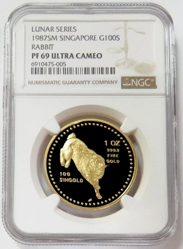 1987 GOLD SINGAPORE 100 SINGOLD 1 OZ YEAR OF RABBIT COIN NGC PROOF 69 UC