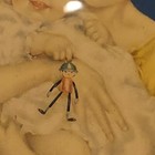Mother Baby holding Rattle or toy  by Charlotte Becker — photo 2