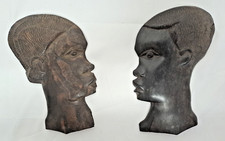 Pair of African hand-carved dark wood face profile wall plaques