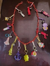 Vintage 80s Plastic Clip On Bell Charm Necklace  13 Rare Charms 