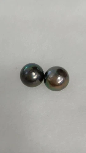 A PAIR 12-13MM NATURAL TAHITIAN BLACK PEACOCK LOOSE PEARL FULL DRILLED