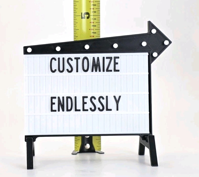 A customizable mini cinema marquee sign for your desk — retro letter-board charm in a tiny, glowing package.