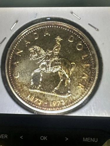 1973 Toned Canadian Silver Dollar Proof Like  ( Lightly Toned)