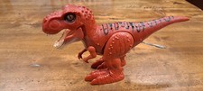 ZURU Robo Alive attacking T-Rex robotic toy dinosaur in red