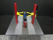 1:64 Scale METAL 2 Post Lift red w/ mechanic figure & drain CAR IS NOT INCLUDED