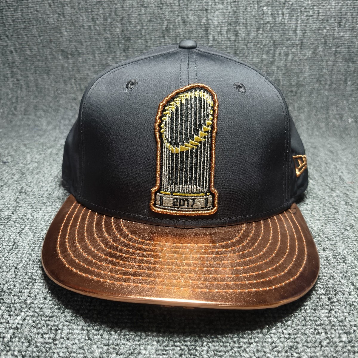 New Era 9FIFTY 2017 World Series Trophy Snapback Hat Cap Black Copper Adjustabl