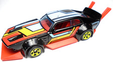 2015 HOT WHEELS MAD MANGA BLACK 1:64 DIECAST 3 1/4 CAR WITH RED BLUE & YELLOW
