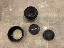 Nikon 50mm f1/1.8 Lens + hood and Nikon L1A 52mm filter