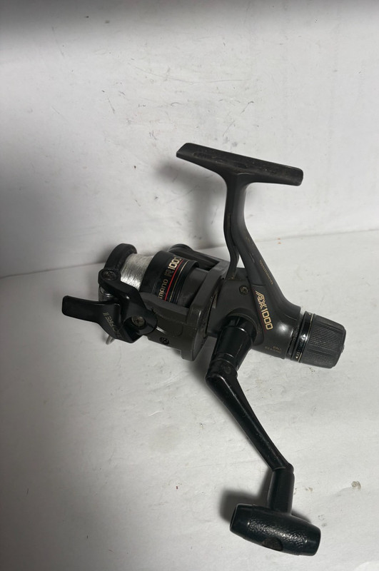 SHIMANO AX 1000 SPINNING REEL- VERY NICE -REAR DRAG 