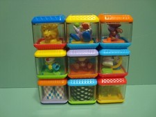 9 - Fisher Price Mixed Peek A Boo Peek-a-Boo Sensory Baby Busy Building Blocks