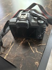 AI Overview 2 The image shows a Canon EOS M50 or Canon EOS M50 Mark II mirro