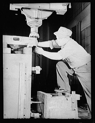 Photo:Industrial Worker Operating Machine 1940s Plant Factory Process