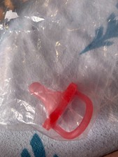 lot of five pacifiers, four sre new in the package and never opened.