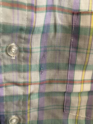 Men’s long-sleeve button-up shirt with green, purple, yellow, and red plaid pattern, featuring two chest pockets.