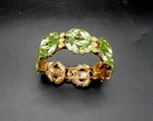 Vintage costume jewelry bracelet with green rhinestones and uranium glass accent
