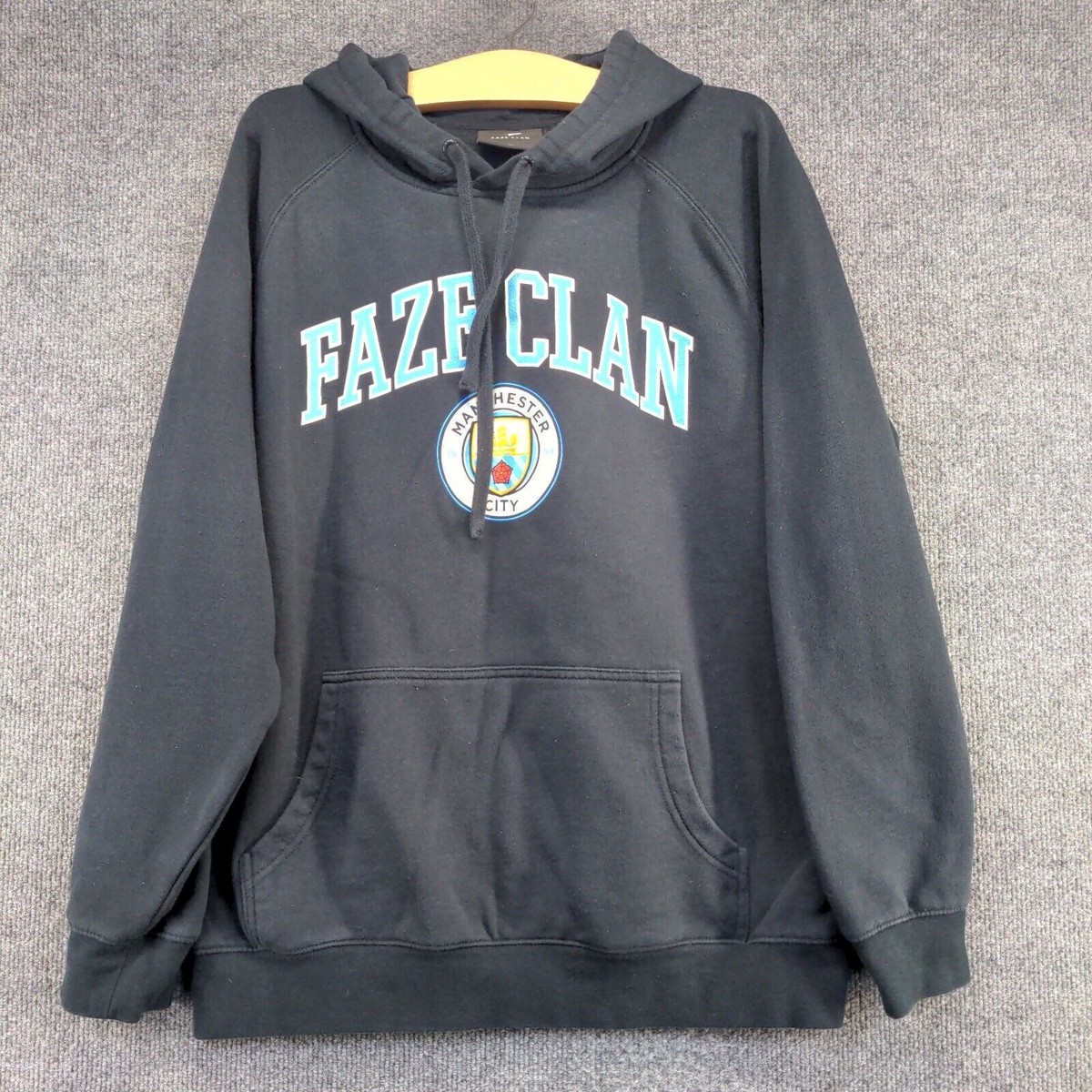 Faze Clan Manchester City Men's Spell Out Pullover Graphic Hoodie