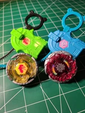 Beyblade Evil Befall and Earth Virgo lot of 2 with launchers and tools