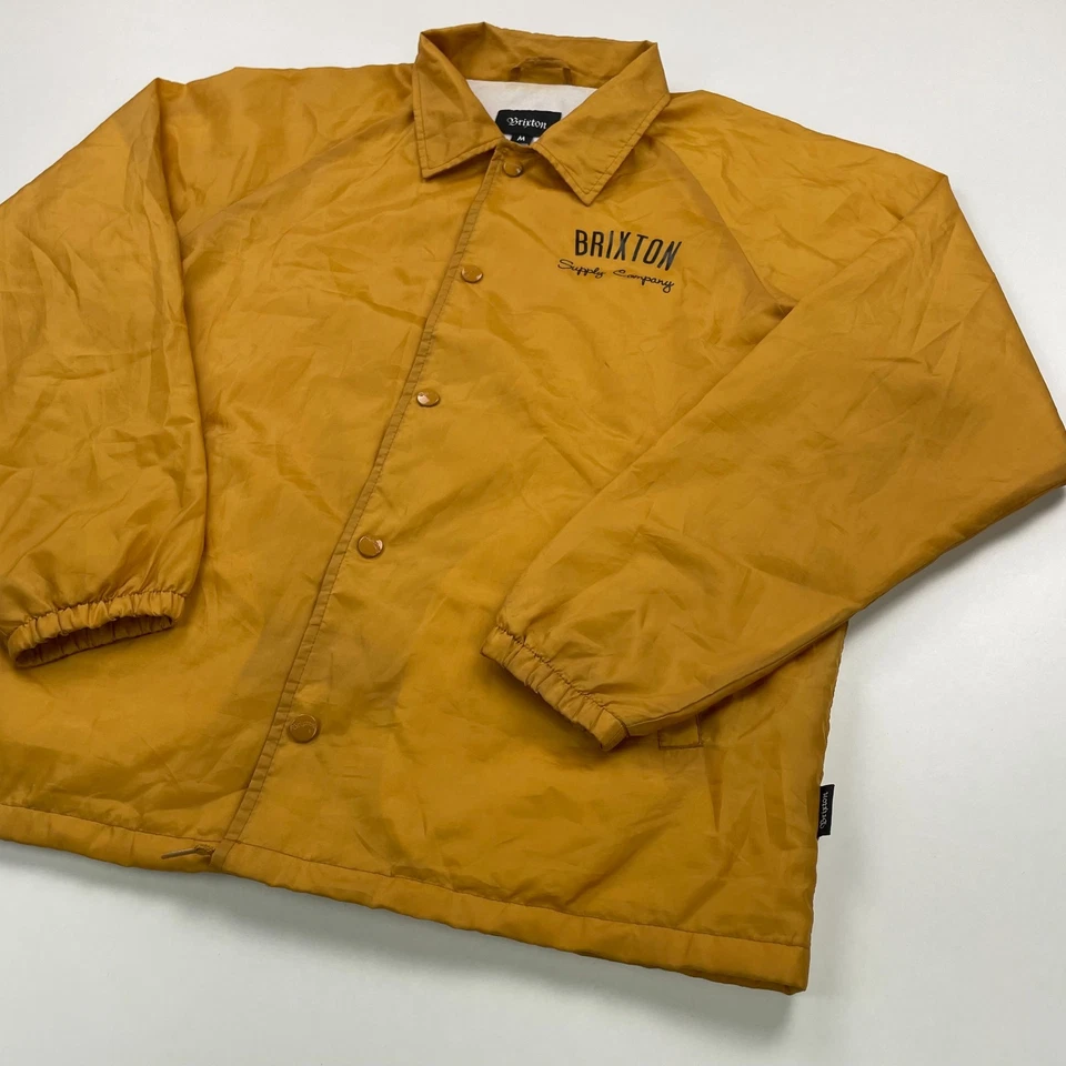 Chaqueta cortavientos Brixton CLYDE Coach para hombre mediana dorada amarilla forrada frontal a presión Foto 4 de 4