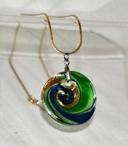 slumped glass round multicolor pendant spiral motif with yellow metal chain